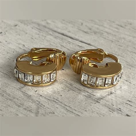 dior huggies|Dior tribal clip earrings.